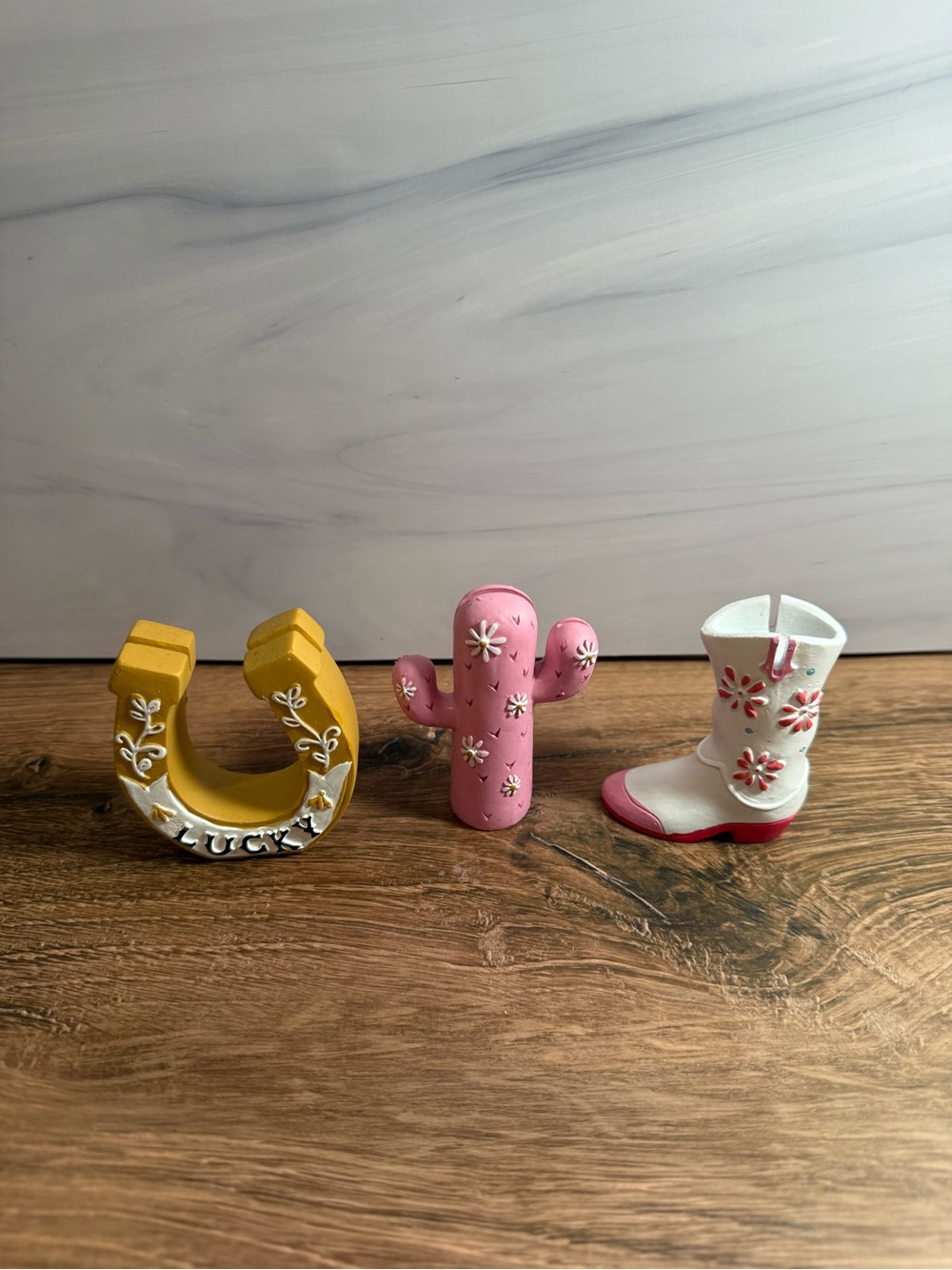 Ashland Yellow Horseshoe, Pink Cactus, and White Pink Cowboy Boot Figurines